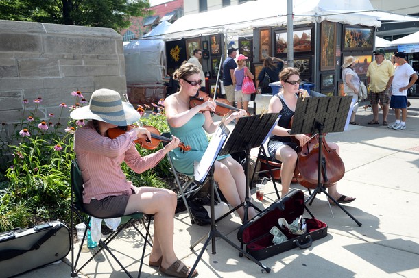 Musicians perform on the corner of  E. William St. and S. Thompson St. on Wednesday, July 17, 2013. Melanie Maxwell | AnnArbor.com
